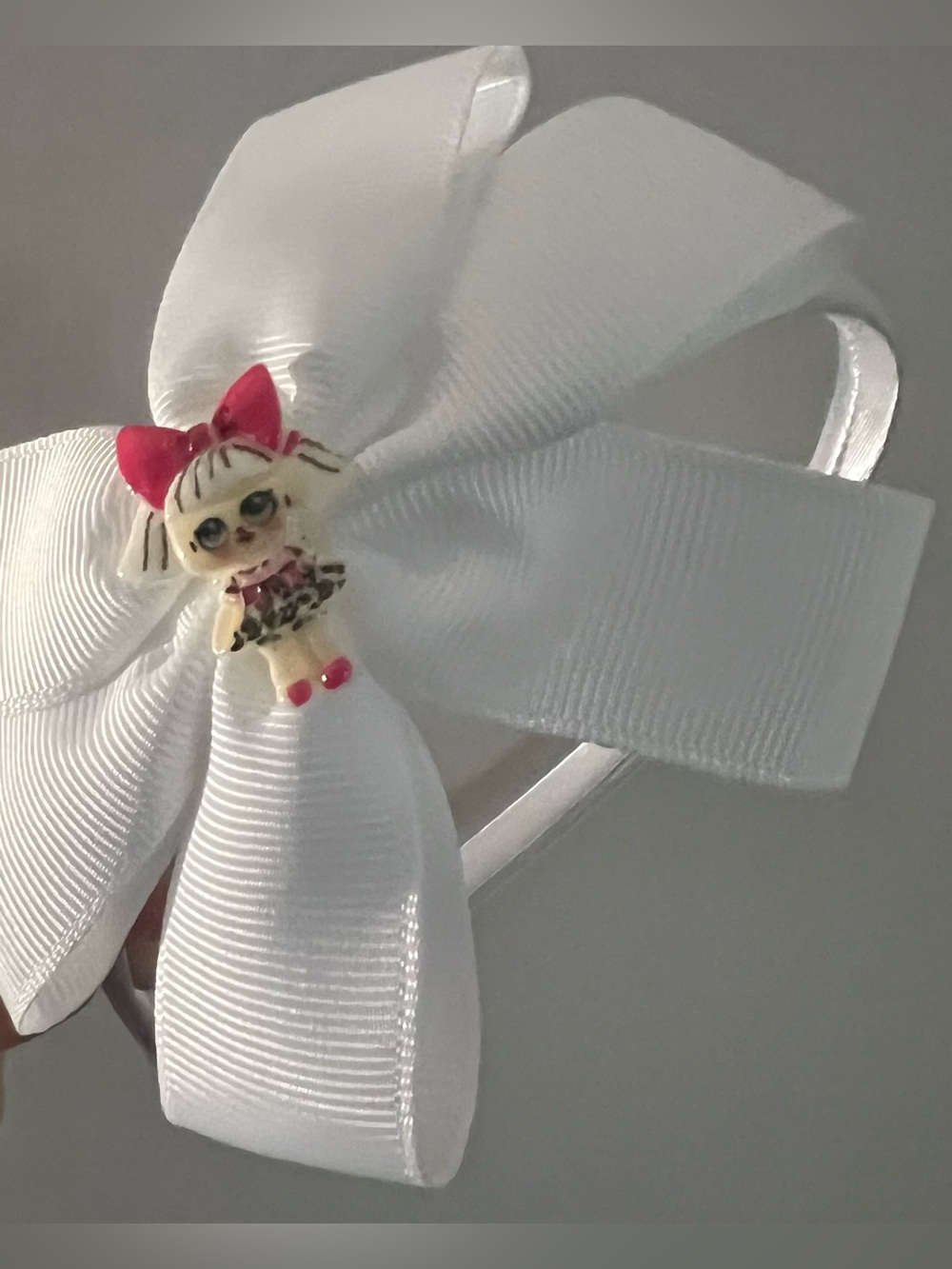 White Bow Headband with Pink-Accented Doll Charm